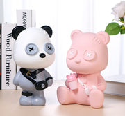 UN ORSETTO CON OCCHI A BOTTONE SALVADANAIO A