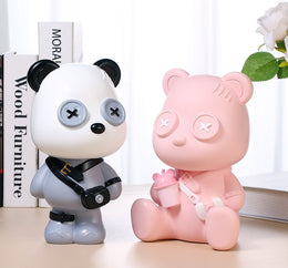 UN ORSETTO CON OCCHI A BOTTONE SALVADANAIO A